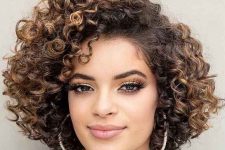 a long bob with natural curls with a darker root and caramel balayage looks very eye-catchy and very lively
