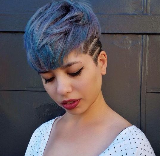 a metal blue and black undercut longer pixie haircut is a bold idea