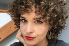 a short volumetric curly bob with a slight balayage is a bold and catchy idea to rock