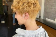 a tapered wavy pixie with bold edges and softness to bring the bulk of the curl towards the face