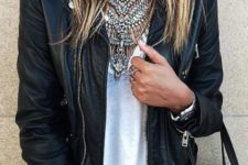 04 a chic look with layered statement necklaces on a top and a leather jacket for a rock feel