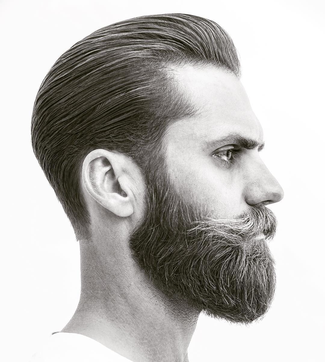 a tapered slicked back haircut with a full beard is a popular hipster cut, don't forget a beard with mustache