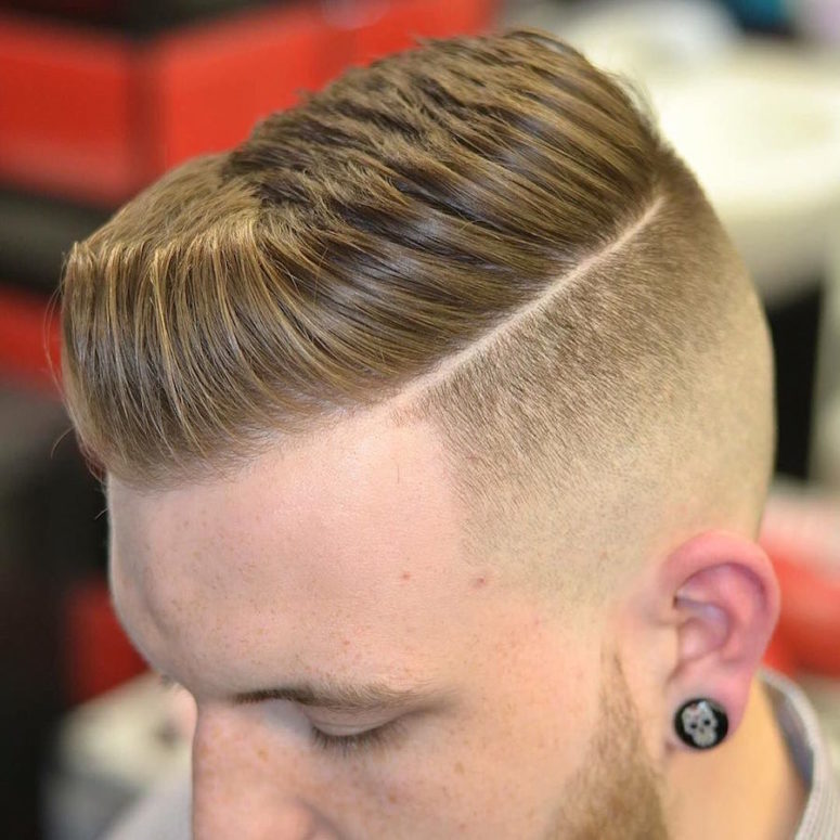 a short pompadour and a hard part is a classic cut with a fresh twist and shorter length