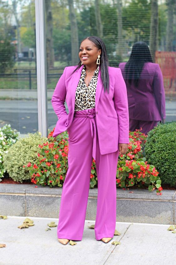 a neon pink pantsuit, a leopard shirt, metallic shoes and statement earrings for ladies who love bright and bold