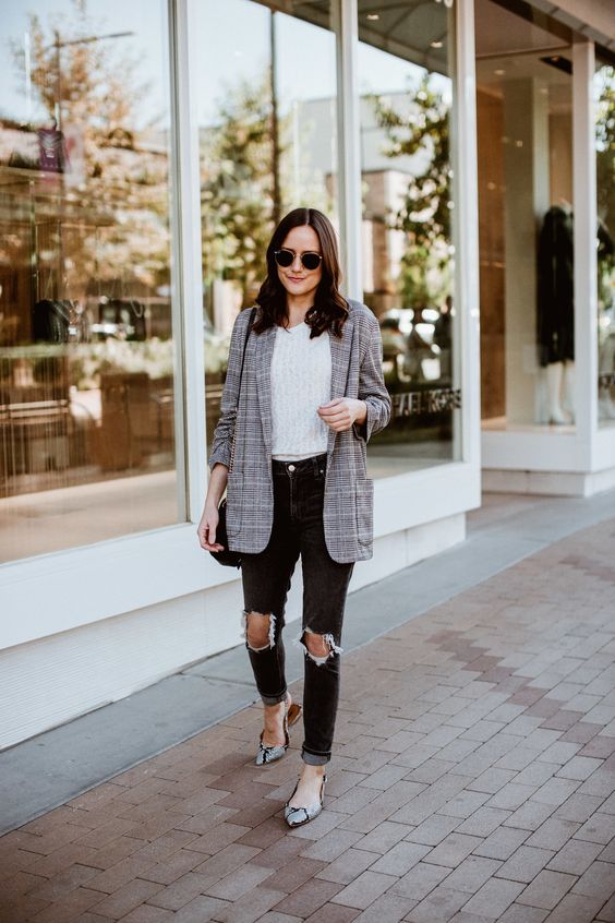 a grey checked blazer, a neutral tee, black ripped jeans, snaked print pointed shoes