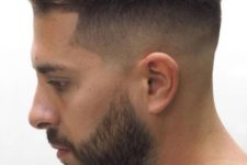 07 a high and tight haircut with faded sides and a curvy top plus s beard looks chic