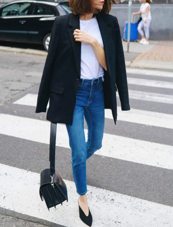 a casual look with a white tee, blue jeans, a black blazer, black pointed shoes and a bag
