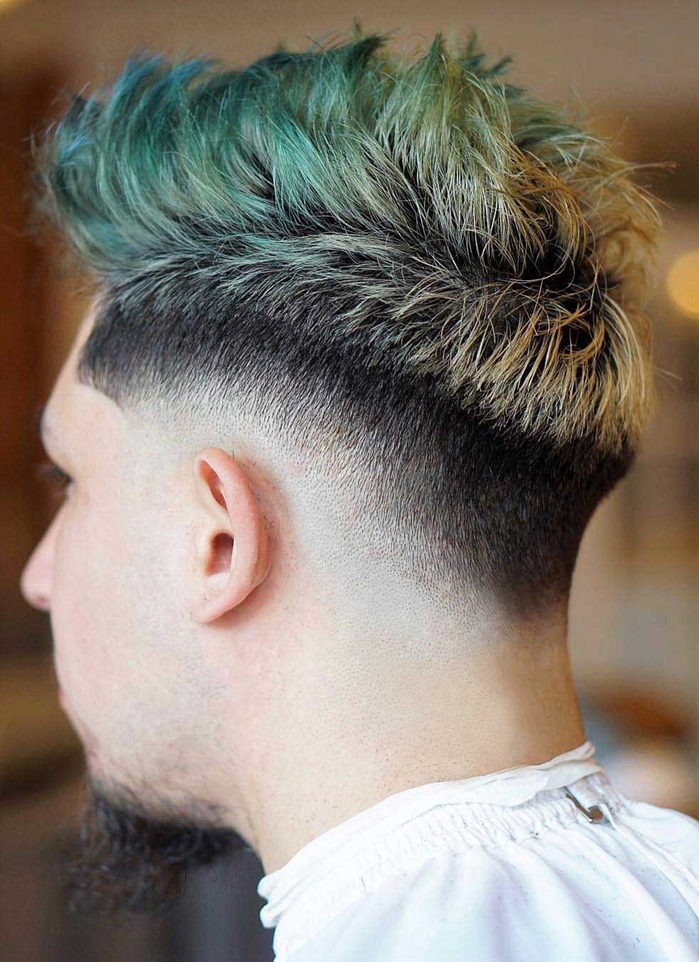 A dyed drop fade faux hawk is a bold idea for those who dare