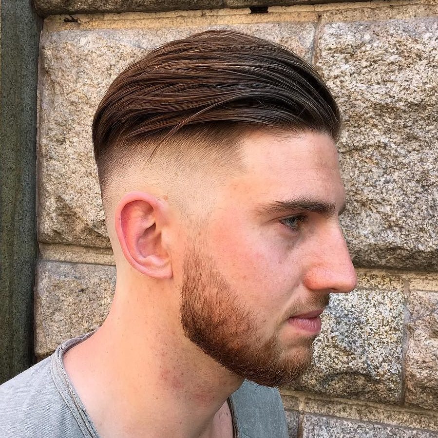 A disconnected combed back undercut and a beard is a gorgeous idea for a modern man