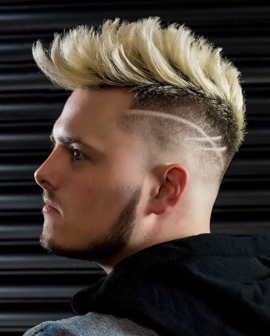 A dyed faux hawk with a disconnected design looks very eye catchy thanks to the lines and color