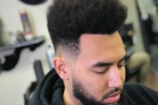 11 a curly high top fade is a cool idea to wear medium length and features a curly texture