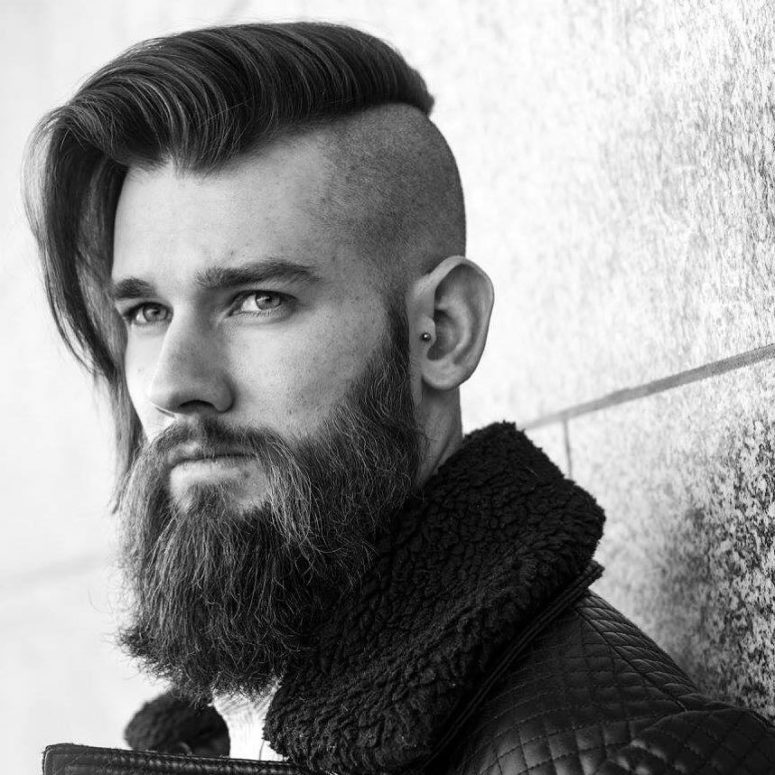 a long straight haircut with a disconnection and a beard is a very catchy masculine idea