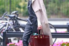 16 Olivia Palermo in leather overalls, a classic duster, Dior boots and crocodile Hermès Birkin bag