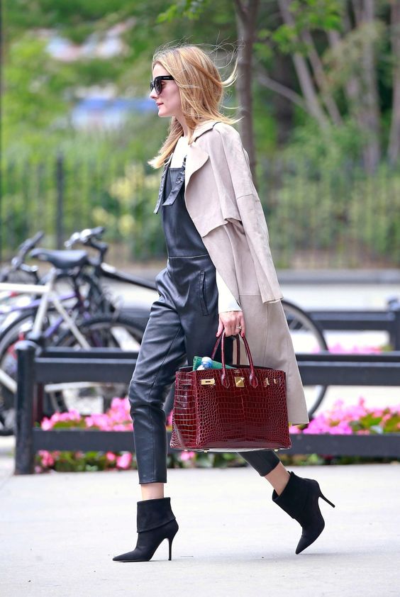Olivia Palermo in leather overalls, a classic duster, Dior boots and crocodile Hermès Birkin bag
