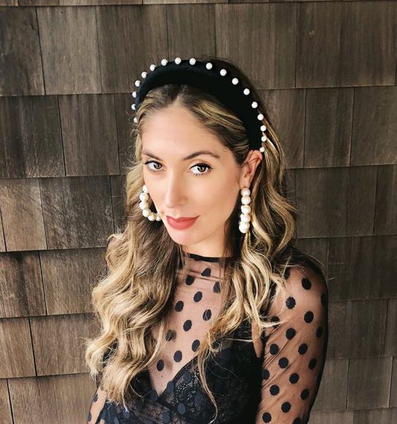 a black velvet headband with pearls and matching pearl earrings that wow