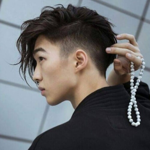 an undercut with long bangs is a cool alternative for those who love longer hair with a bit of styling