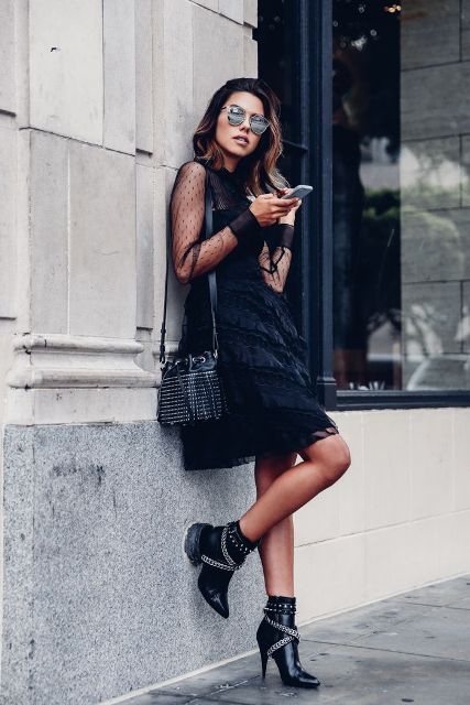 With black dress, embellished bag and sunglasses