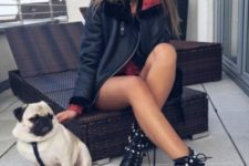 With black leather jacket and printed mini dress