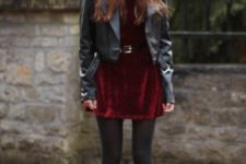 With black leather jacket, hat, black tights and platform shoes