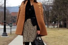 With black shirt, brown coat, bag, black tights and black shoes