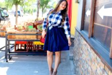 With blue skirt, red bag and cutout boots