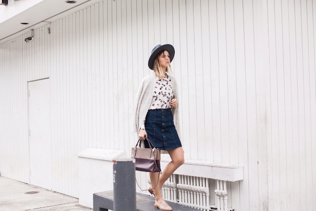 With denim skirt, hat, white cardigan and bag