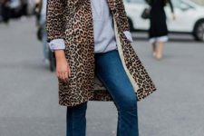 With gray sweatshirt, leopard coat and cropped jeans