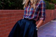 With navy blue A-line skirt