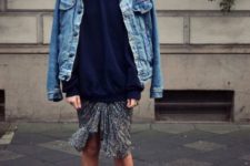 With navy blue loose sweater, printed skirt and lace up high heels