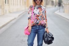 With pink bag, cuffed jeans, black jacket and platform shoes