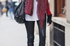 With red shirt, fur vest, black tote, black leather pants and printed scarf