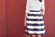 With striped skirt, red shoes and brown tote