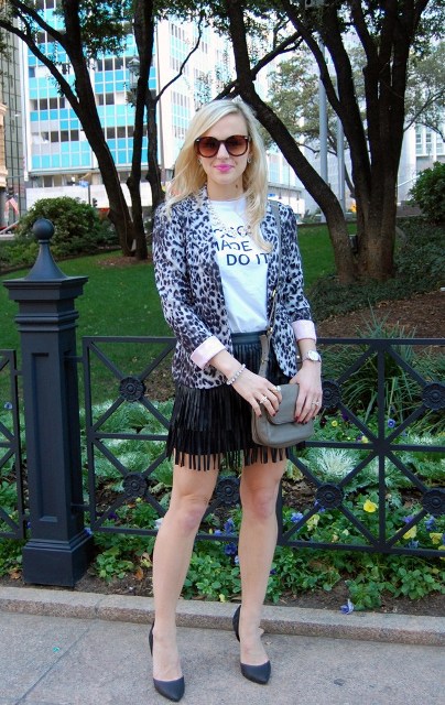 With t-shirt, fringe skirt, small bag and pumps