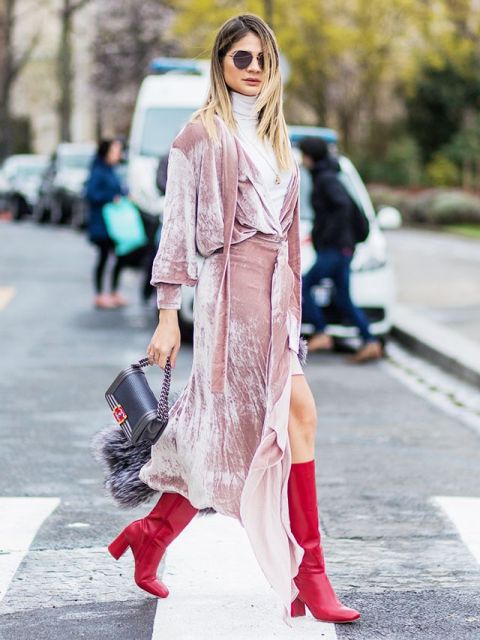 With white mini dress, fur bag and red high boots