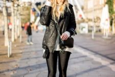 With white sweater, black leather jacket, crossbody bag and leggings