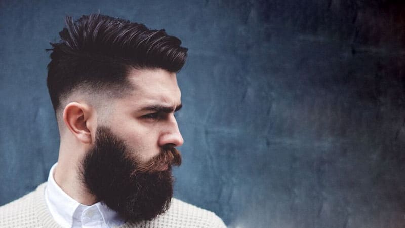 A low fade combover with a beard is a bold idea for a hipster