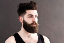 a messy pompadour with low fade is a structural haircut and a beard adds hispter chic
