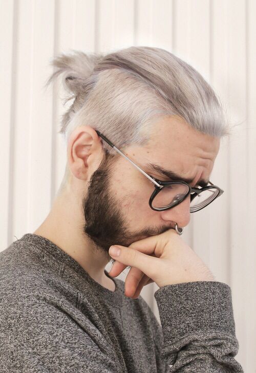 silver blonde hair, longer on top and shorter ont he sides, plus a black beard