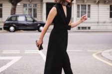 04 a black jumpsuit with a skirt over it, a tiny black clutch and black heels