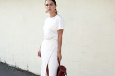 05 a white tee, a wrap maxi skirt, white sneakers and a brown backpack plus statement earrings