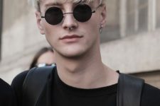 05 icy blonde hair, longer on top and shorter on the sides plus piercing for a catchy rock look
