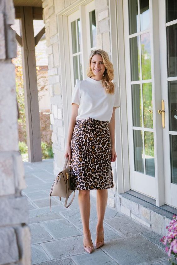 a white tee, a leopard print skirt, blush shoes and a neutral bag for spring