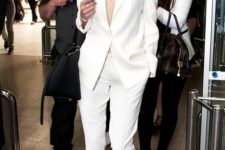 10 a creamy pantsuit, a small nude top, nude ankle strap heels and a necklace