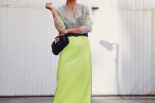 13 a sheer blouse, a green neon sequin midi, a black clutch and metallic shoes