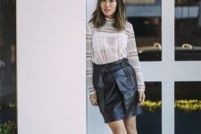 14 a crochet lace top with long sleeves, a black leather skirt, nude and black slingbacks