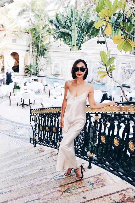 an ivory silk slip midi dress with black heels is a timeless combo, just add a clutch