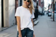 18 navy cropped jeans, a white tee, a blush bag and statement earrings