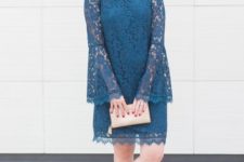 With beige clutch and leopard ankle strap shoes