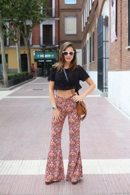 With black crop top, platform shoes and brown crossbody bag