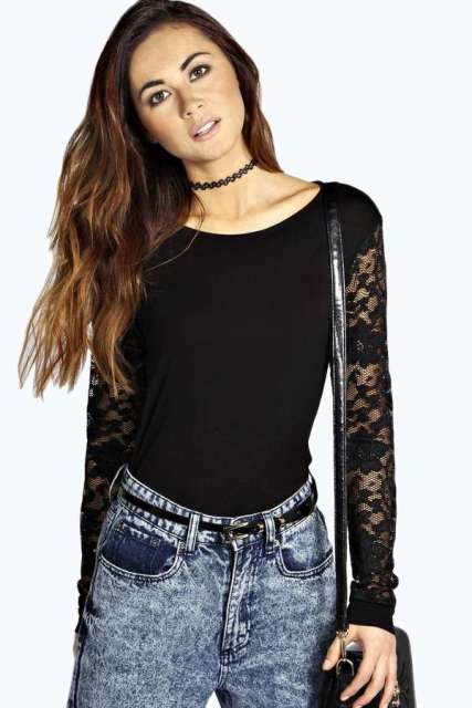 With black leather bag and high-waisted jeans